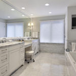 Large bright white marble bathroom