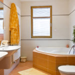 Private bathroom design in orange tones