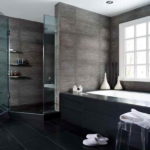 Bathroom in a private house. Black tile. Stretch ceiling.