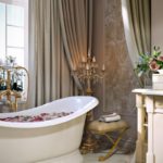 Modern art deco bathroom design and gilded candelabra