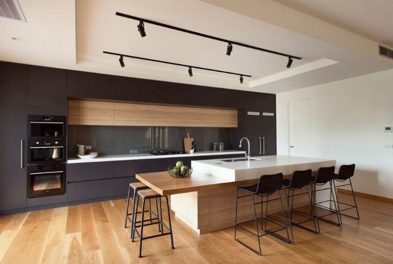 Black kitchen with walnut insert