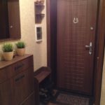 Brown furniture in a small corridor