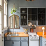 Mirror above a kitchen sink in a private house