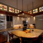 Stained-glass windows under the ceiling of the kitchen of a country house