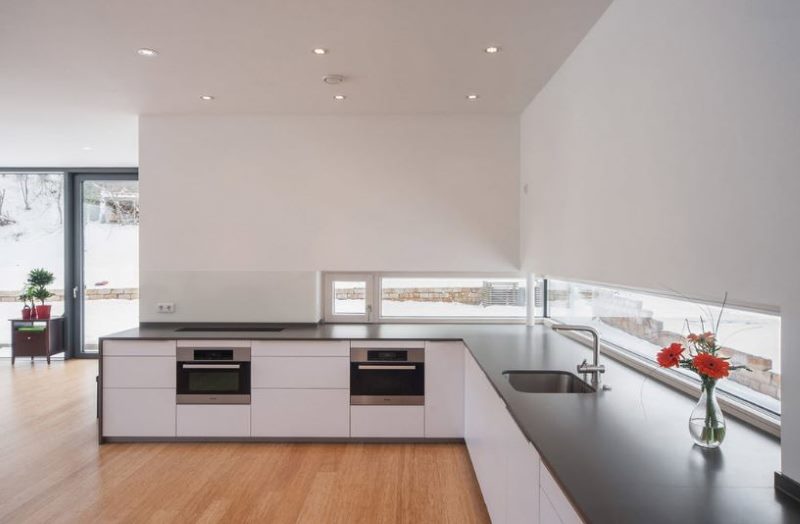 Floor cabinets white headset with a dark countertop