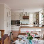 Luxurious spacious kitchen with a jumbled wallpaper