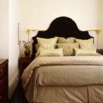 Black headboard against white wall