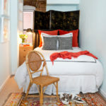 Wooden chair near the bed in the bedroom