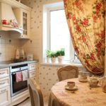 Curtain with flowers in the kitchen interior