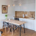 Dining group in front of a niche kitchen