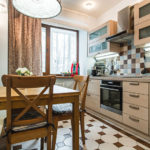 Wooden furniture in a linear kitchen