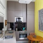 Wooden table in a gray kitchen