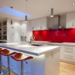 Realization of lighting in the kitchen with a red apron