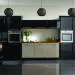 Black and white kitchen with glossy floor.