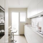 Narrow kitchen with balcony door