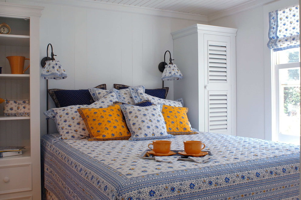 Decorative pillows in a small bedroom Provence