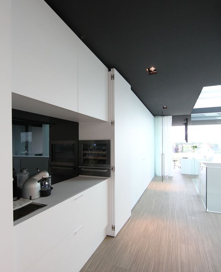 Sliding panels in a high-tech kitchen