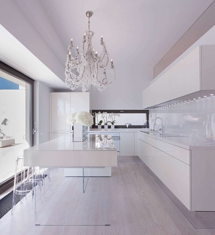 Snow-white kitchen in a technological style with an island