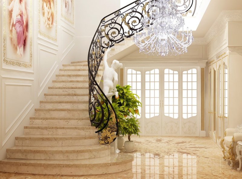 Escalier avec garde-corps en fer forgé dans le hall d'une maison privée