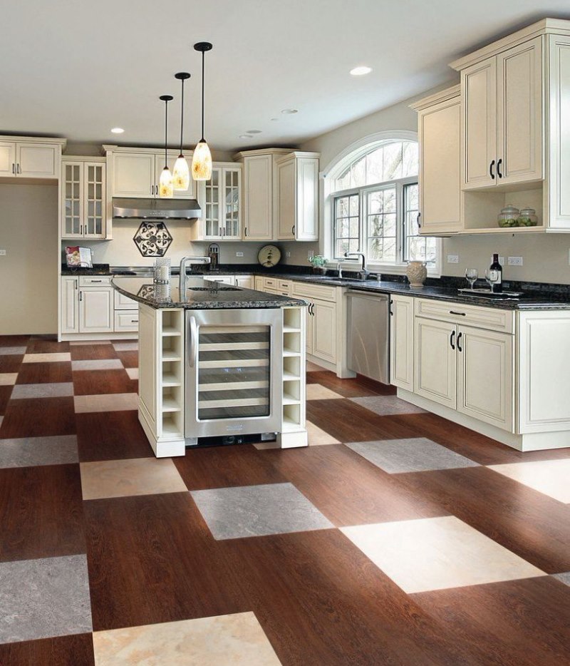 Chess laying of combined tiles on the kitchen floor