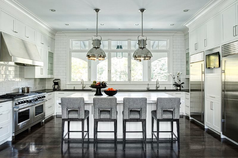 Dark floor in the kitchen with a white set