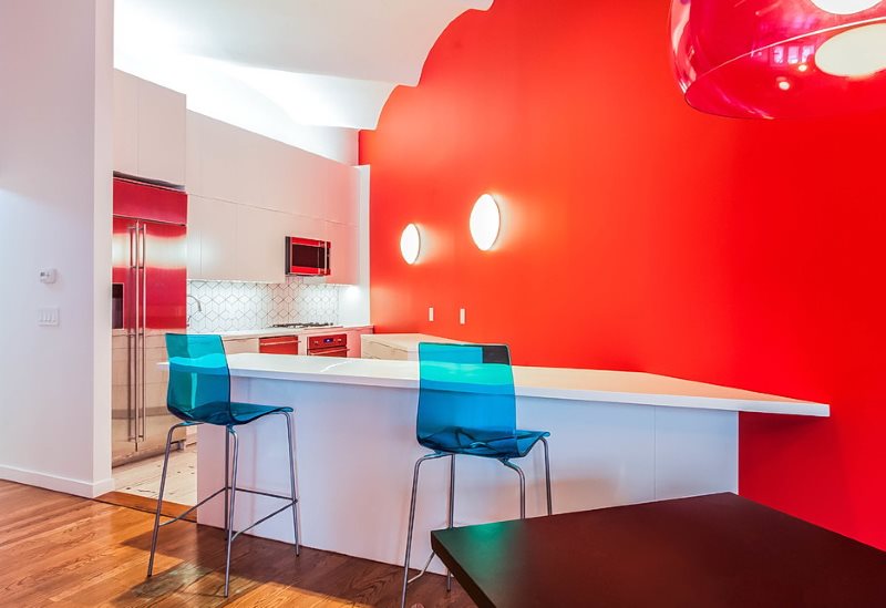 Scarlet wall in the kitchen with white furniture