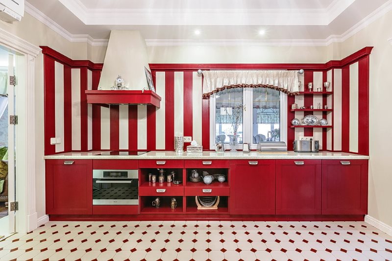 Kitchen design in red and white colors.