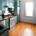 Set with tall cabinets in an eclectic style kitchen