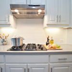 Illumination of the working area in the kitchen in a city apartment