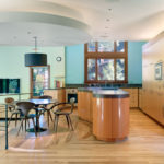 Wooden floor in the large kitchen-dining room