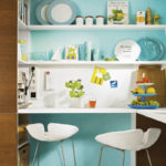 Kitchen utensils on white shelves