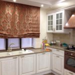 Roman curtain over the kitchen sink