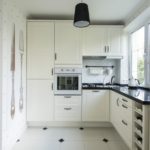 Black lamp on the ceiling of the kitchen