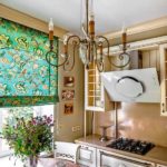 Chandelier with candelabra on the ceiling of a modern kitchen