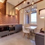 Cucina in stile loft design con divano