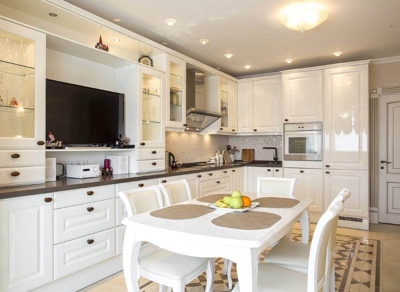 Organization of lighting in a white kitchen with glossy facades