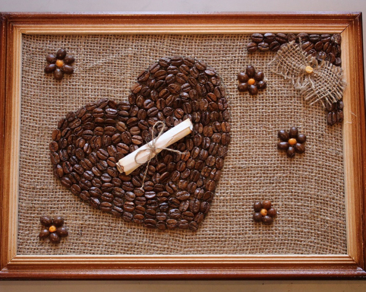 Heart of coffee beans in a picture in a wooden frame