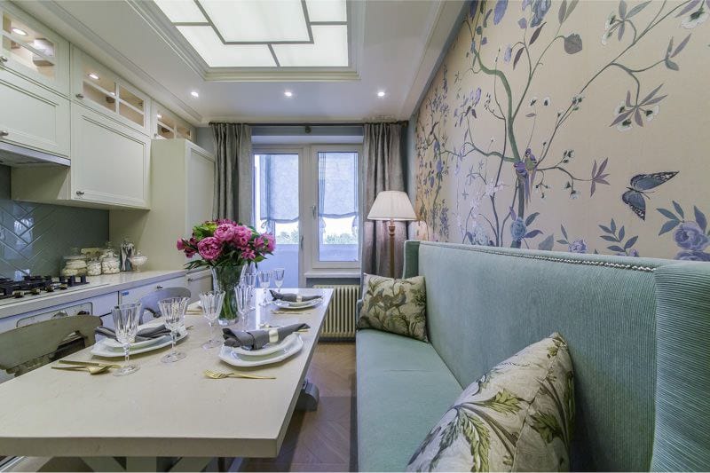 Beige wallpaper in the kitchen with a blue sofa