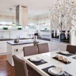 Glass chandelier over a kitchen dining table