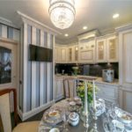 Striped wallpaper in the interior of a small kitchen