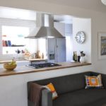 Dark gray sofa along the kitchen island