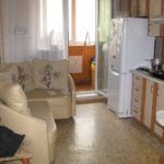 Two-chamber refrigerator at the balcony door