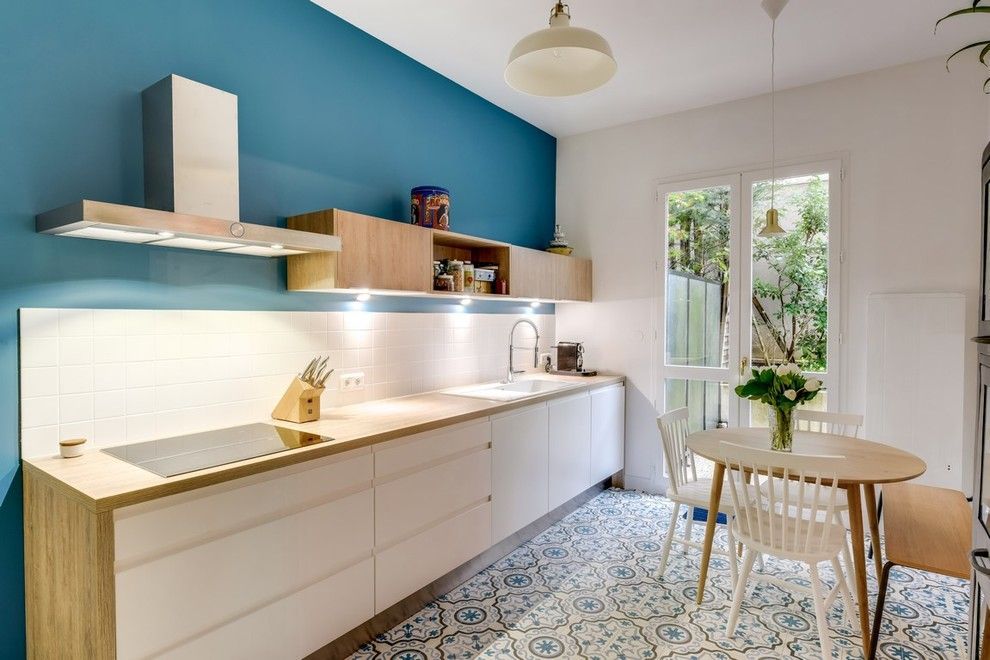 Scandinavian-style linear kitchen with dining area