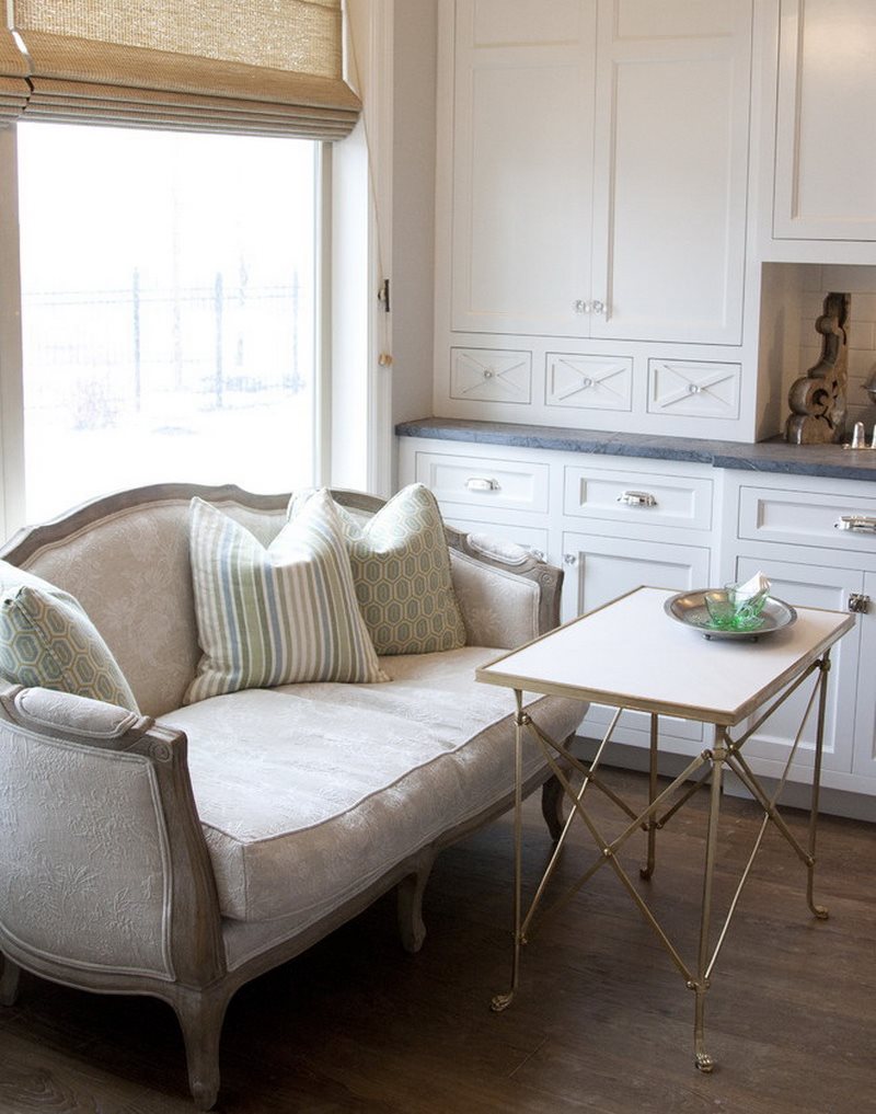 A small table in front of the kitchen sofa