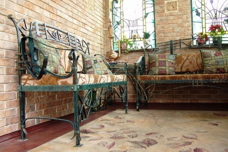 Forged furniture in the interior of the kitchen in a country house