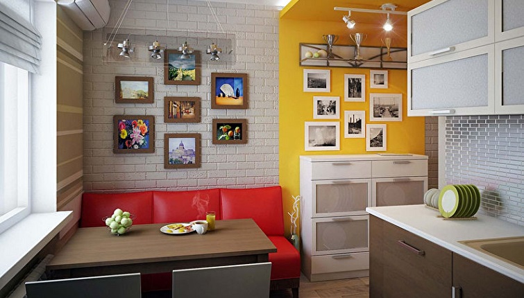 Red leather sofa in the kitchen of a city apartment