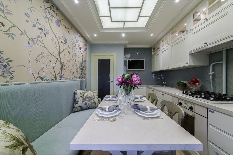 Design provence style narrow kitchen with blue sofa