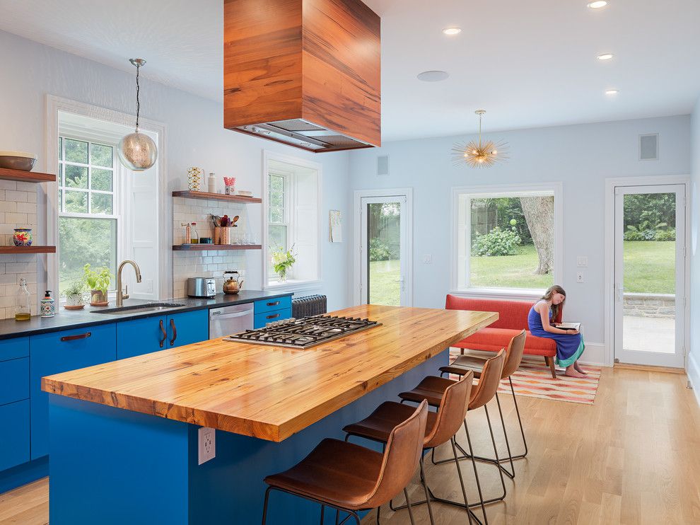 Design of a large kitchen in a private house with blue walls