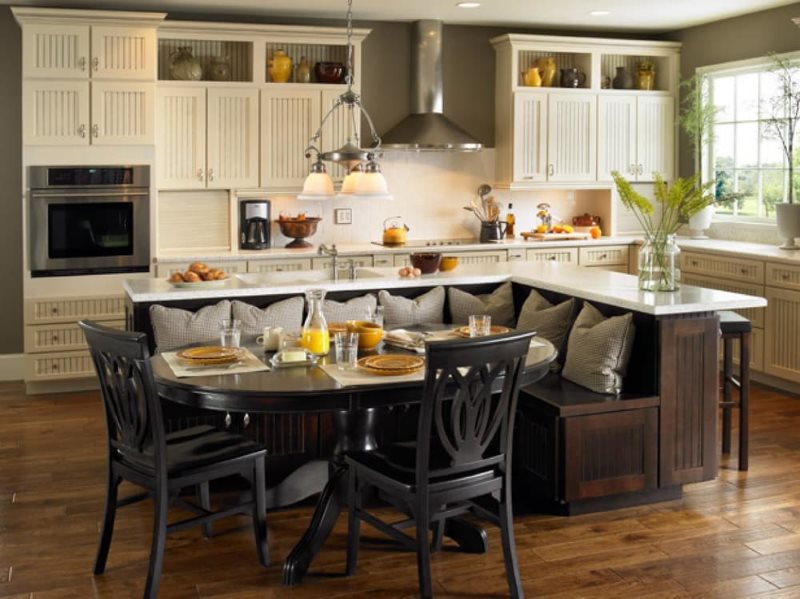 Interior of a large kitchen with a sitting area in the middle of the room