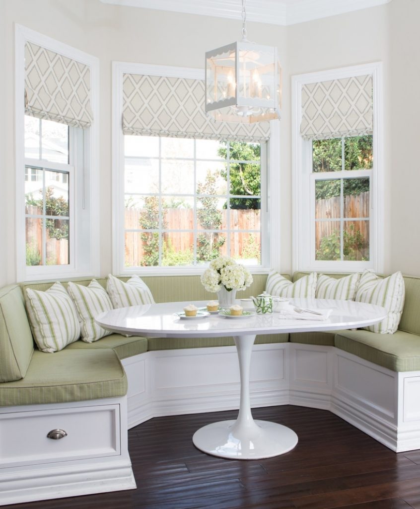 Dining area in bay window with sofa